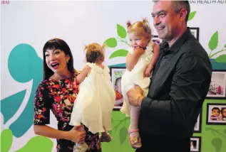  ?? Anna Nielsen for The National ?? Oxana Josan and Andrei Ianovici with their twin girls Victoria and Arina. The couple turned to medical science for help after trying to conceive naturally for five years.