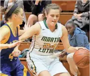  ?? JOHN KLEIN / FOR THE MILWAUKEE JOURNAL SENTINEL MILWAUKEE JOURNAL SENTINEL ?? Martin Luther's Emily Hafemann drives around St Joeseph’s Nathalie Cairo in Tuesday night’s game.