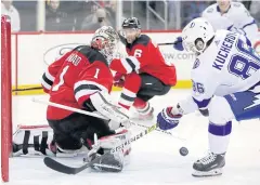  ?? AP ?? The Lightning’s Nikita Kucherov attempts a shot at the Devils.