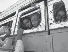  ?? NARIMAN EL-MOFTY/AP FILE ?? Refugees who fled the conflict in Ethiopia’s Tigray region ride a bus near the Sudan-ethiopia border in 2020.