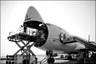  ?? PROVIDED TO CHINA DAILY ?? Cargo is unloaded from a charter flight of Cargolux Airlines Internatio­nal in Zhengzhou Airport, Henan province.