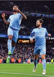  ?? — AFP ?? Manchester City’s English midfielder Raheem Sterling celebrates scoring his team’s fourth goal during their English Premier League match against Leicester City at the Etihad Stadium in Manchester on Sunday.