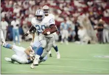  ??  ?? After being drafted third overall in 1989, Barry Sanders ran off to a Hall of Fame career with the Detroit Lions. [AP PHOTO/DONNA CARSON]