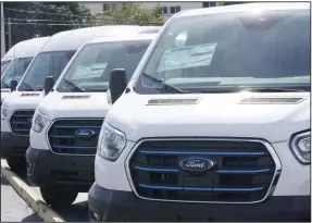  ?? (AP) ?? Ford E-Transit electric vans are displayed at a Gus Machado Ford dealership in Hialeah, Fla., in this file photo.