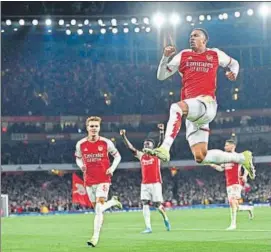  ?? AFP ?? Gabriel Magalhaes (C) celebrates the first Arsenal goal against Newcastle.