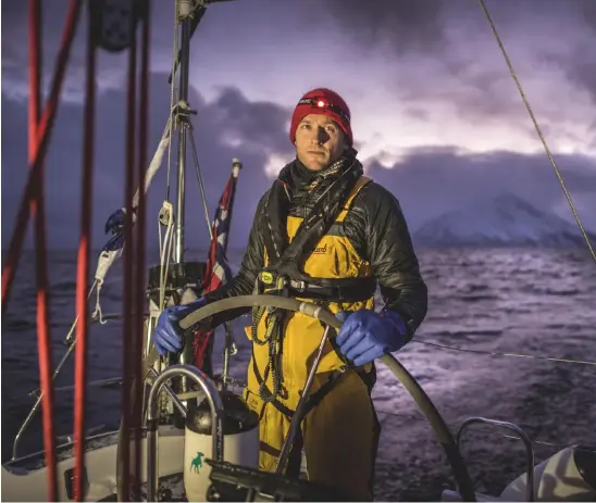  ??  ?? Above: Andreas at the helm in Troms, Norway.
Left: scouting for orcas outside Senja, in Troms