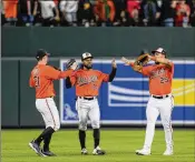  ?? JESS RAPFOGEL/ASSOCIATED PRESS ?? Orioles outfielder­s (from left) Austin Hays, Cedric Mullins and Anthony Santander celebrate a recent victory over the Pirates. Baltimore is in second place in the loaded American League East.