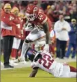  ?? AP photo ?? Tyreek Hill of the Chiefs leaps over the Giants’ Adoree’ Jackson after catching a pass during the first half Monday.
