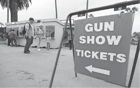  ??  ?? Gun shows are coming back to North Texas after COVID- 19 restrictio­ns closed them down. HAYNE PALMOUR IV/ TNS