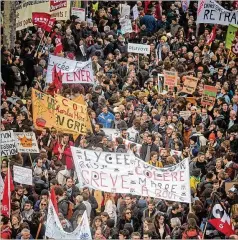  ?? KIRAN RIDLEY / GETTY IMAGES ?? Thousands in Paris march Tuesday to protest pension system changes proposed by President Emmanuel Macron.