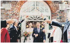  ??  ?? WE DID IT!: The newlyweds showered with confetti.