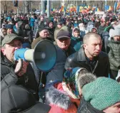  ?? AUREL OBREJA/AP ?? People shout anti-government slogans at a protest initiated by the Movement for the People and the Russia-friendly Shor Party on Sunday in Chisinau, Moldova.
