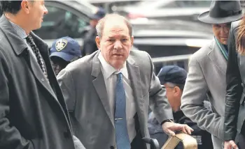  ?? — AFP file photo ?? Weinstein arrives at the Manhattan Criminal Court, in New York City on February 18, 2020. The Court of Appeals on Thursday found the trial judge erred in admitting the testimony of additional women who were allegedly abused by Weinstein but who were not named in the charges brought against him, and ordered a new trial.