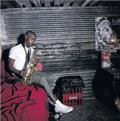  ?? PHOTO: SUPPLIED ?? Bongani hones his skills of blowing a saxophone in a shack which he uses as shelter.