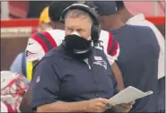  ?? CHARLIE RIEDEL - THE ASSOCIATED PRESS ?? New England Patriots head coach Bill Belichick wears two masks as hewatches fromthe sideline during the first half of an NFL football game against the Kansas City Chiefs , Monday, Oct. 5, 2020, in Kansas City.