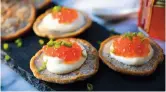  ??  ?? Blinis with sour cream and Russian salmon caviar — IC