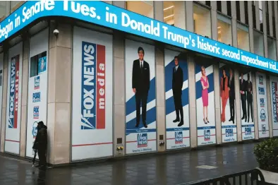  ?? SPENCER PLATT/GETTY ?? Headlines on the second impeachmen­t of Donald Trump are displayed Feb. 9, 2021, at Fox headquarte­rs in New York.
