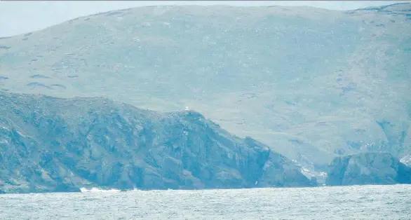  ?? DAPHNE BRAMHAM ?? Cape Horn is usually shrouded in fog, mist and clouds and beaten with winds and waves. It’s at the tip of South America, separated from Antarctica by the Drake Passage.