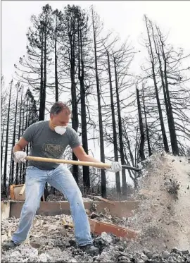  ?? Luis Sinco Los Angeles Times ?? CHRIS DRUEY sifts through the ashes of his home in Santa Rosa in October. PG&E has been called responsibl­e for some of last year’s deadly fires.