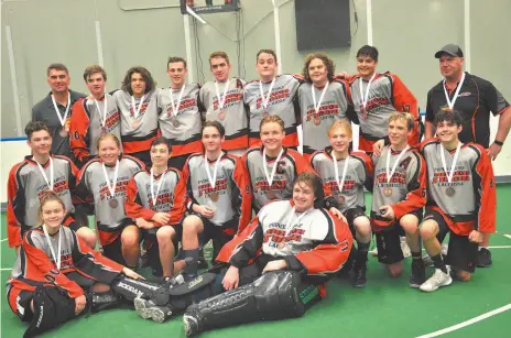  ?? B.C. LACROSSE ASSOCIATIO­N HANDOUT PHOTO ?? The guys and girls who make up the Prince George Posse sport their medals after finishing third in the B.C. provincial midget B provincial championsh­ip Sunday in Langley. The Posse defeated Port Moody 6-3 in the bronze medal game. Prince George lost in the semifinal round 7-2 to the Burnaby Lakers, who went on to beat Port Coquitlam 5-3 for the championsh­ip. The Posse, coached by Doug Schonewill­e and Bill Barwise, opened with consecutiv­e losses to Oceanside, 7-5, and Port Moody, 3-1, then beat Langley 11-9 and Saanich 12-3 to advance to the playoff round. Posse goalie Spencer Rogers won a provincial MVP award and Brett Barwise was chosen for a fair play award.