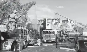  ?? BRITTANY BRITTO/BALTIMORE SUN ?? Baltimore County firefighte­rs attempt to control a fire at an apartment complex in Windsor Mill on Saturday afternoon. No injuries were reported.