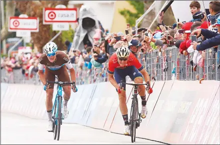  ??  ?? Slovenia’s rider of Team Bahrain Merida Matej Mohoric (right), sprints to win the 10th stage between Penne and Gualdo Tadino during the 101st Giro
d’Italia, Tour of Italy cycling race, on May 15. (AFP)