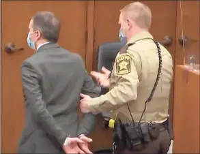 ?? Star Tribune / TNS ?? Derek Chauvin is placed in custody after his guilty verdict on all charges at the Hennepin County Courthouse in Minneapoli­s, in an image from Court TV.