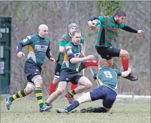  ??  ?? Lorne MacLachan hurdles this Helensburg­h tackle.