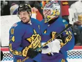  ?? FRANK GUNN/AP ?? Team Matthews captain Auston Matthews, left, and Jake Oettinger celebrate after winning the NHL All-Star Game on Saturday in Toronto.