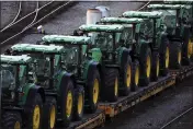  ?? GENE J. PUSKAR — THE ASSOCIATED PRESS FILE ?? John Deere tractors sit in Norfolk Southern's Conway Yard in Conway, Pa., on Dec. 5.