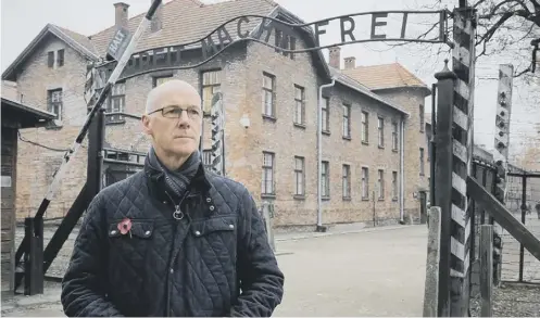  ?? PICTURE: PA ?? Deputy First Minister John Swinney stands by the gates at Auschwitz death camp yesterday