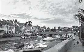 ?? Christina House/Los Angeles Times/TNS ?? Debra Newell and John Meehan shared a $6,500-a-month bayfront rental on Balboa Island, where they spent time walking along the boardwalk and watched sailboats and the yachts slide over Newport Harbor.