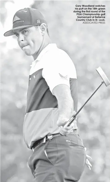  ?? ASSOCIATED PRESS ?? Gary Woodland watches his putt on the 18th green during the first round of the PGA Championsh­ip golf tournament at Bellerive Country Club in St. Louis.