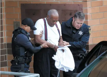  ?? AP PHOTO ?? Bill Cosby is escorted out of the Montgomery County Correction­al Facility in Eagleville, Pa., on Sept. 25 following his sentencing of three to 10 years in prison for sexual assault.