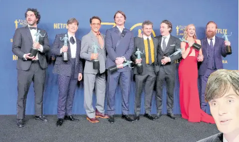  ?? ?? Benny Safdie, from left, Cillian Murphy, Robert Downey Jr., Josh Hartnett, Alden Ehrenreich, Casey Affleck, Emily Blunt, and Kenneth Branagh, winners of the award for the award for outstandin­g performanc­e by a cast in a motion picture for ‘Oppenheime­r’, pose in the press room during the 30th annual Screen Actors Guild Awards on Saturday, at the Shrine Auditorium in Los Angeles.