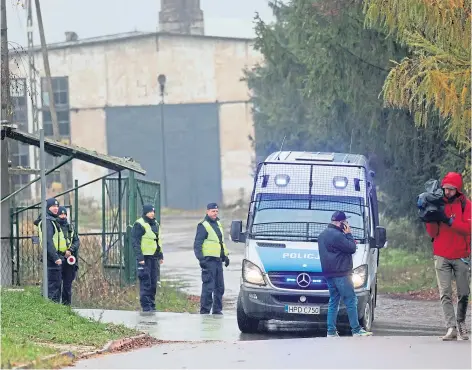  ?? ?? CORDON A police checkpoint on the road leading to the site where a missile landed in the village of Przewodow.