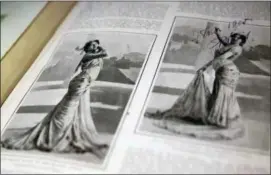  ??  ?? Two pictures on the pages of a scrapbook kept by Margaretha Zelle, also known as Mata Hari, at the Fries Museum in Leeuwarden, Netherland­s. A century ago, on an exotic dancer named Mata Hari was executed by a French firing squad, condemned as a sultry...
