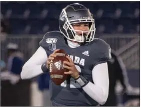  ?? (AP/Tom R. Smedes) ?? Despite an up-and-down season, Nevada sophomore quarterbac­k Carson Strong (above) helped the Wolf Pack go 3-3 on the road last year under Coach Jay Norvell. Nevada will be Arkansas’ first opponent this season.