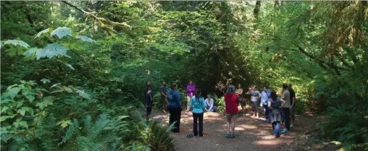  ?? Karen Ducey / Washington Post ?? Students form a circle during a game in the woods as part of a class at the Wilderness Awareness School in Duvall, Wash., last August.