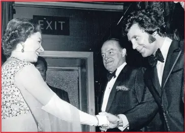  ??  ?? The Queen shakes hands with Tom, as Bob Hope looks on, at London’s Talk of the Town in 1970