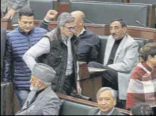  ??  ?? National Conference working president Omar Abdullah with party MLAS inside the assembly during the ongoing budget session in Jammu on Monday.