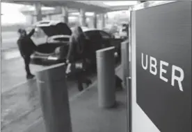  ?? THE ASSOCIATED PRESS FILE PHOTO ?? Uber has revealed that personal informatio­n belonging to about 57 million Uber customers and drivers was stolen by hackers last October.