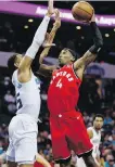  ??  ?? Raptors forward Rondae HollisJeff­erson shoots over Hornets forward P.J. Washington on Wednesday.