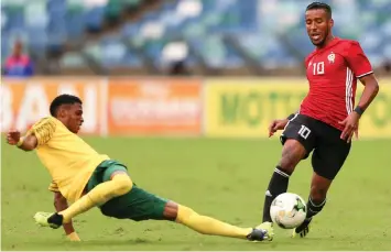  ?? LEON LESTRADE | ANA PICTURES ?? VINCENT PULE and Hamdou Elhouni battle for the ball during their 2019 Afcon qualifier at the Moses Mabhida Stadium on Saturday.