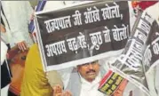  ?? ASHOK DUTTA/HT PHOTO ?? Opposition MLAs displaying placards during the House session on Monday.