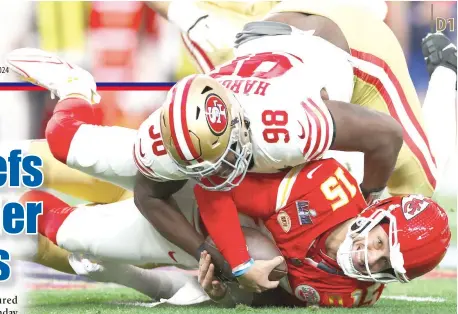  ?? AFP PHOTO ?? Javon Hargrave (top) of the San Francisco 49ers tackles Patrick Mahomes of the Kansas City Chiefs in the first quarter during Super Bowl LVIII at Allegiant Stadium on Sunday, Feb. 11, 2024, in Las Vegas, Nevada.