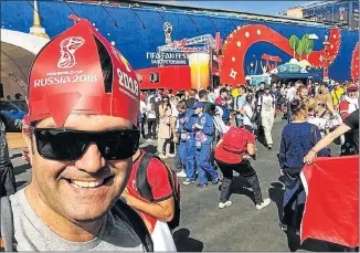  ??  ?? SOAKING IT ALL UP: Alexander Hart, of Port Elizabeth, revels in the pulsating atmosphere at the World Cup fan park in St Petersburg, Russia