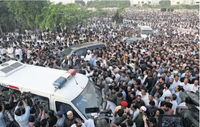  ?? AP ?? People attend funeral of Kulsoom Nawaz, wife of former prime minister Nawaz Sharif in Lahore on Friday. Thousands of mourners attended the funeral days after Kulsoom died at a hospital in London after remaining in critical condition for months. —