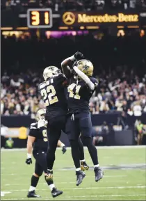  ?? Associated Press photo ?? New Orleans Saints running back Alvin Kamara (41) celebrates his touchdown carry with running back Mark Ingram (22) in the second half of an NFL football game against the Carolina Panthers in New Orleans, Sunday.