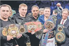  ??  ?? Golovkin poses with his belts after winning the fight. — AFP photo